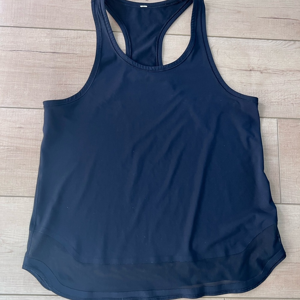 Lululemon tank, black with mesh on the bottom. Size 8